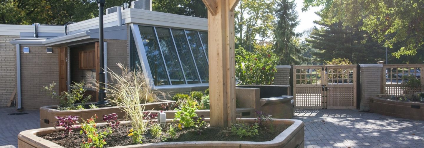 Patio garden with wooden beam holding up canopy
