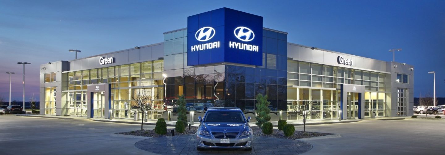 Green Hyundai dealership exterior at night
