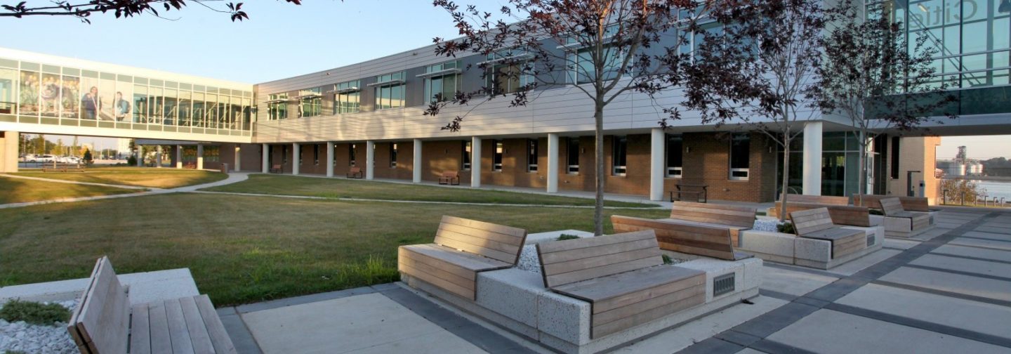 Wooden slat benches on a concrete slab at Western Illinois University Riverfront campus
