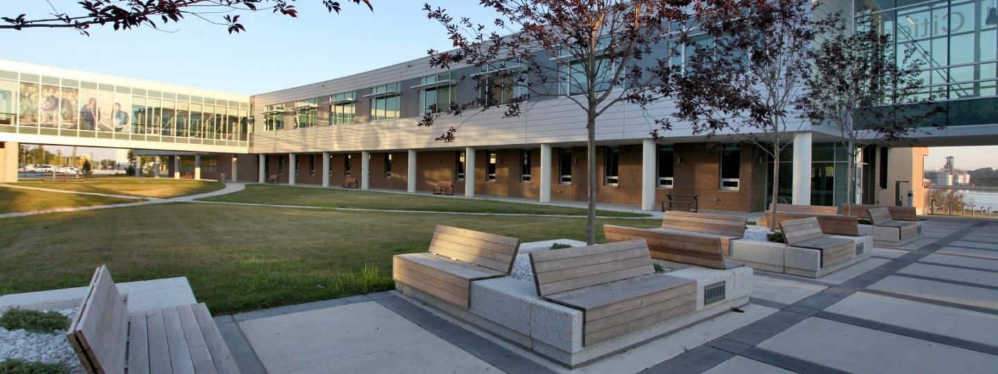 Wooden slat benches on a concrete slab at Western Illinois University Riverfront campus