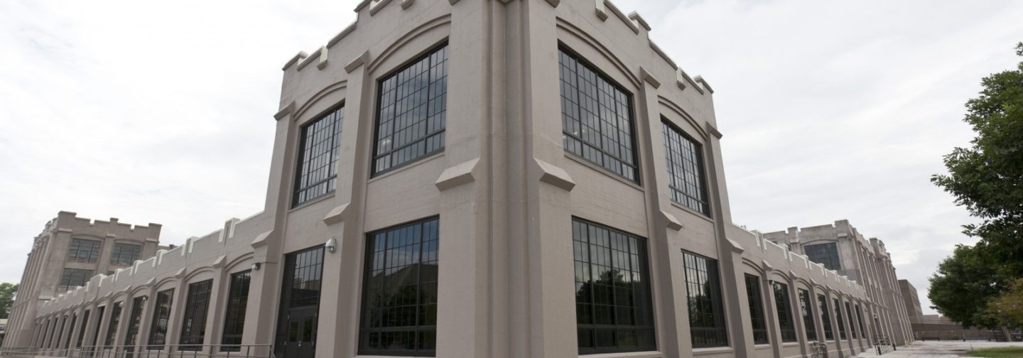 Corner view of arsenal building with black glass windows