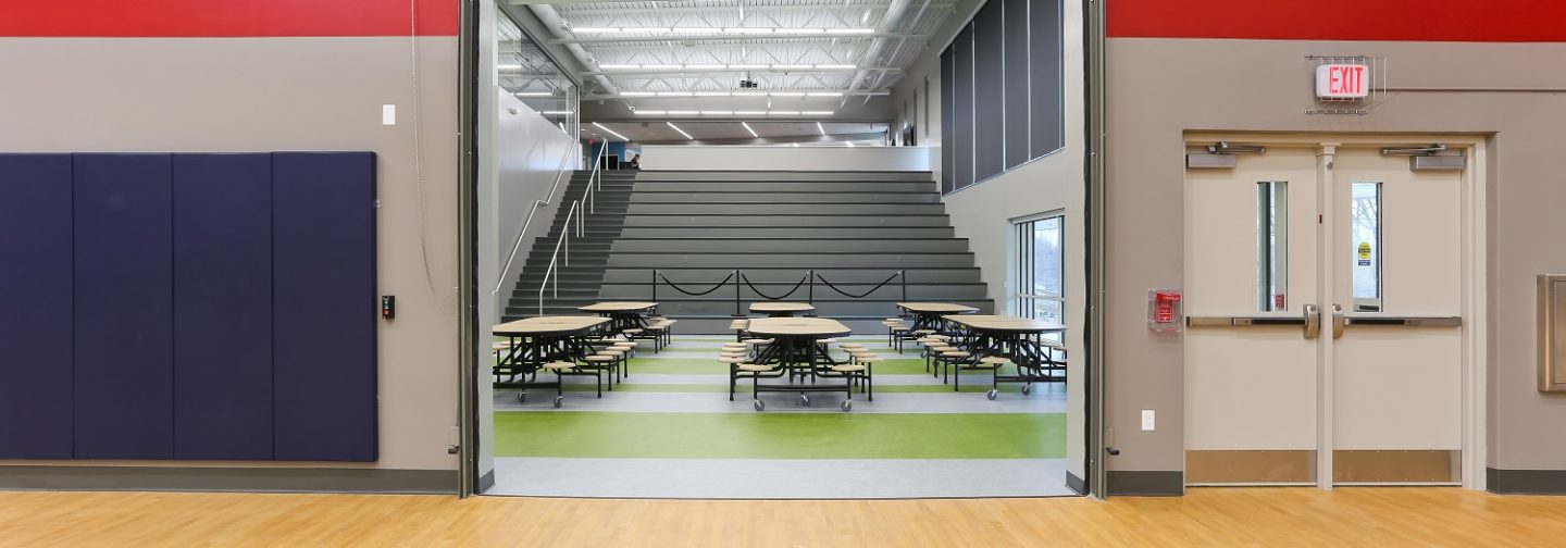 Modern designs and concepts can be seen throughout the new Mark Twain Elementary School, such as this one featuring a garage door from the gym to the cafeteria