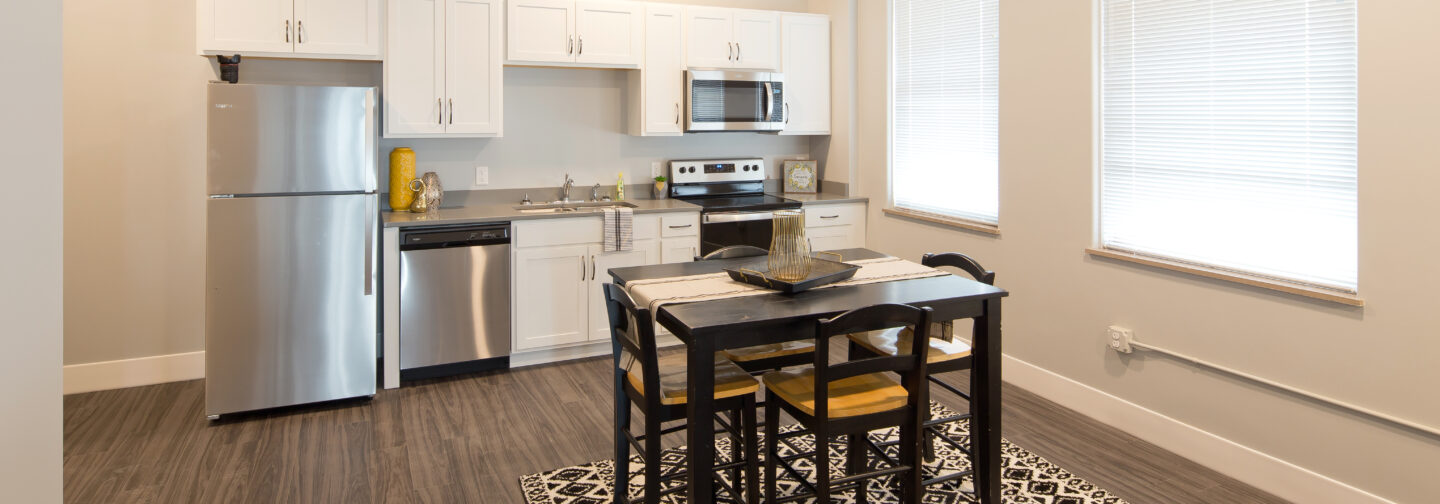 This image represents a kitchen within one of the Hershey Lofts' units in Muscatine, Iowa